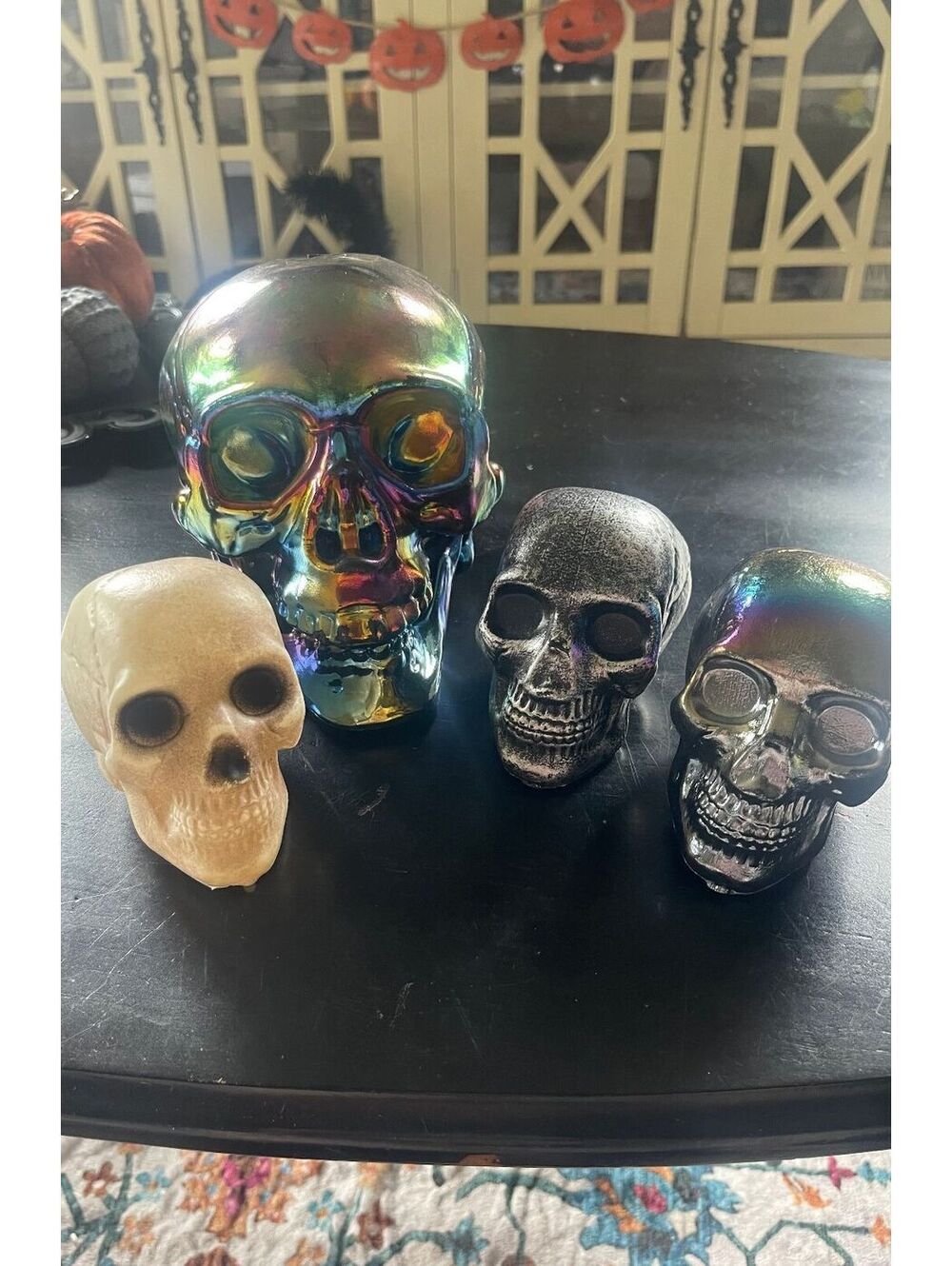 Set of 4 Decorative Skull Figurines - Assorted Colors and Sizes